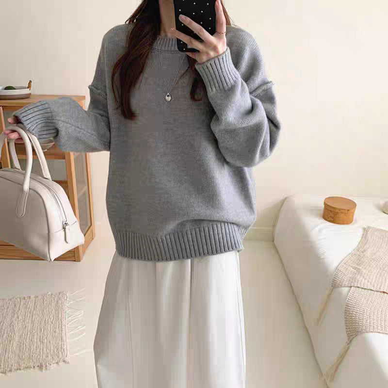 Women's heather gray round-neck knit pullover sweater with ribbed hem and cuffs