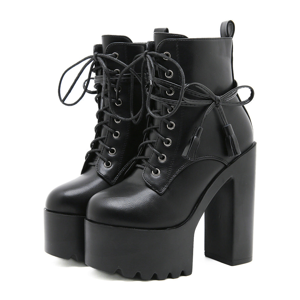 Black lace-up platform boots with chunky block heel and O-ring eyelets