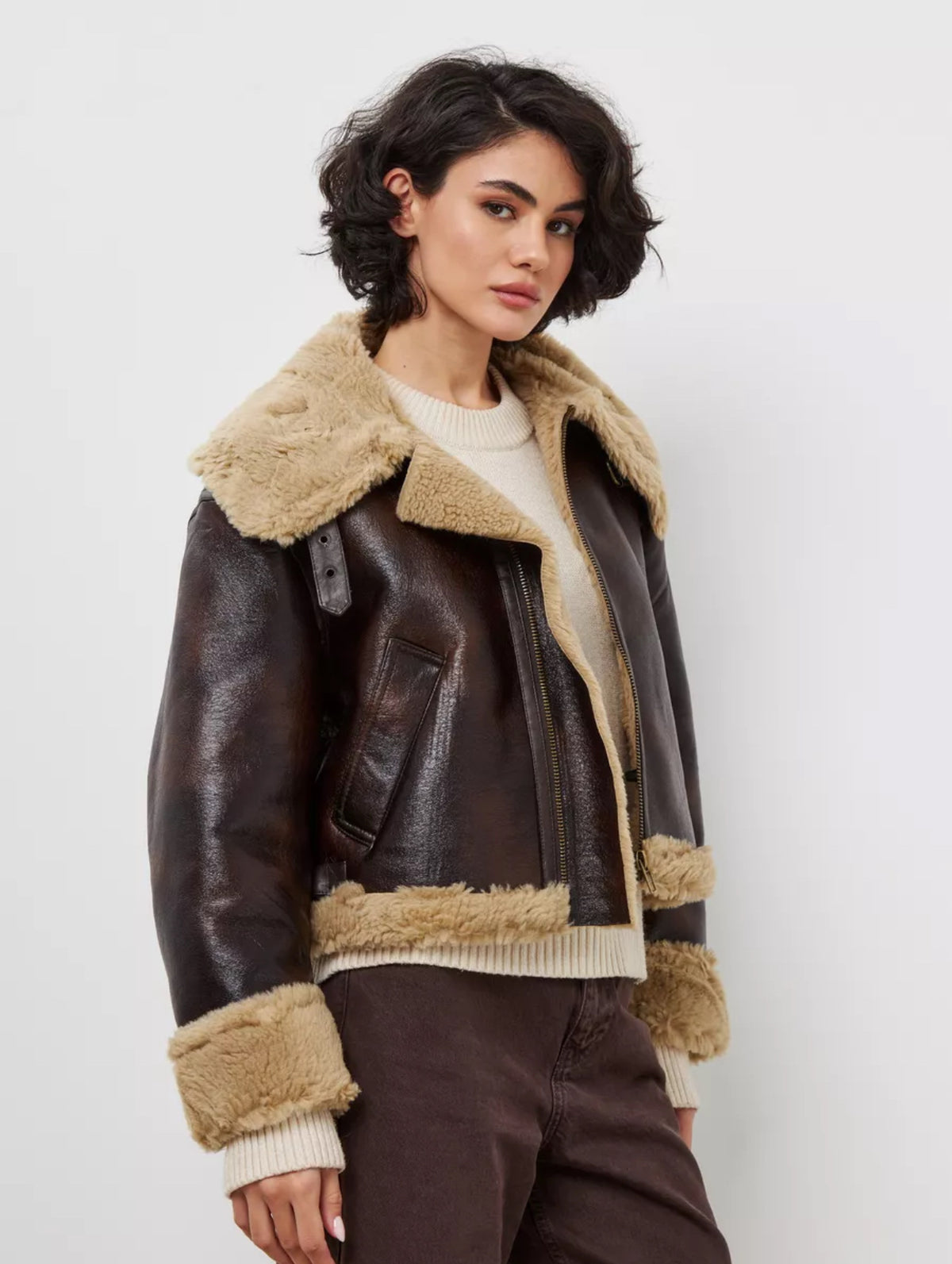 Women's brown leather jacket with tan shearling-trimmed lapels, zip front, sleeve cuffs
