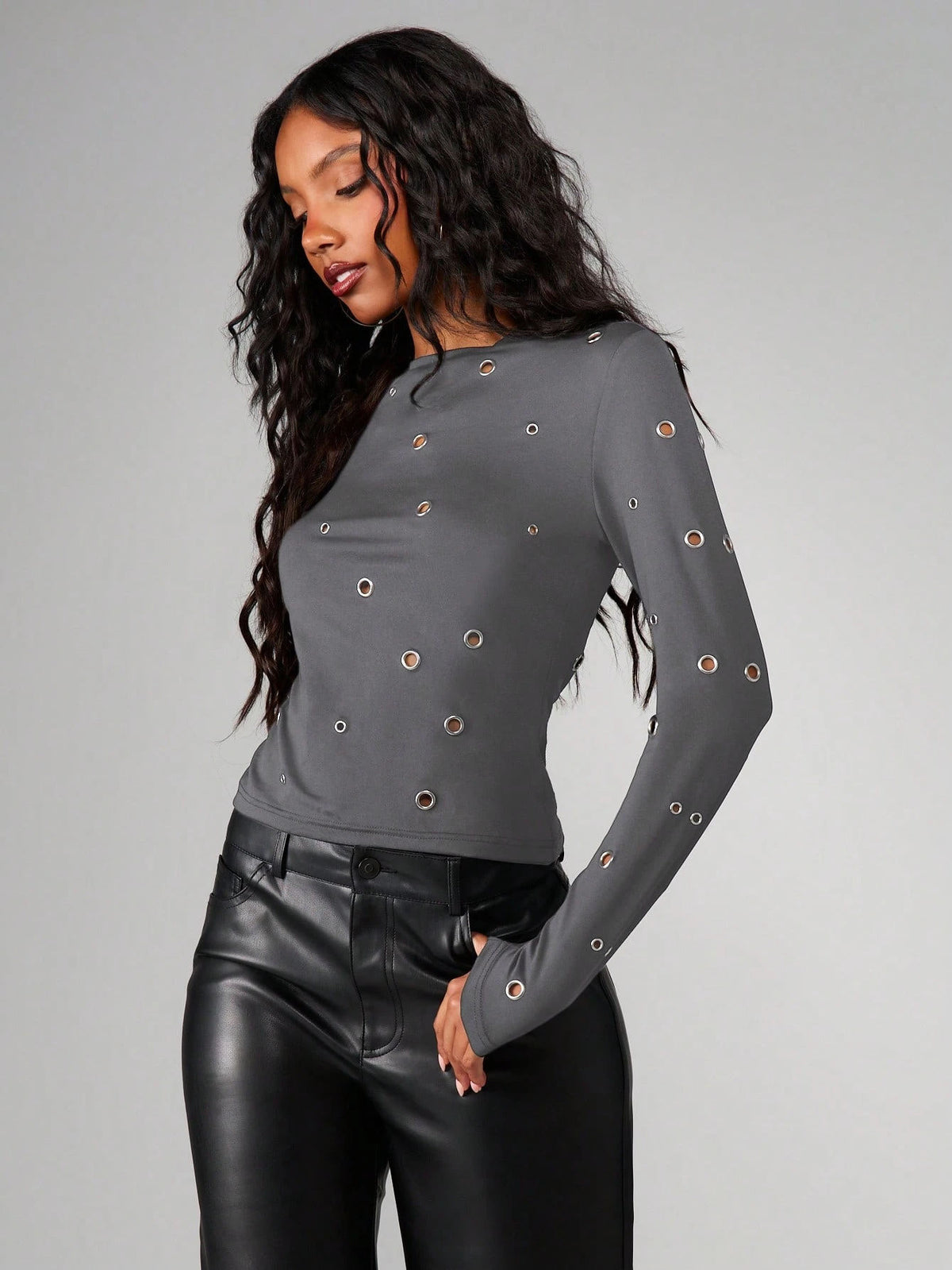 Women’s dark gray long-sleeve round-neck top with metal eyelet grommet accents