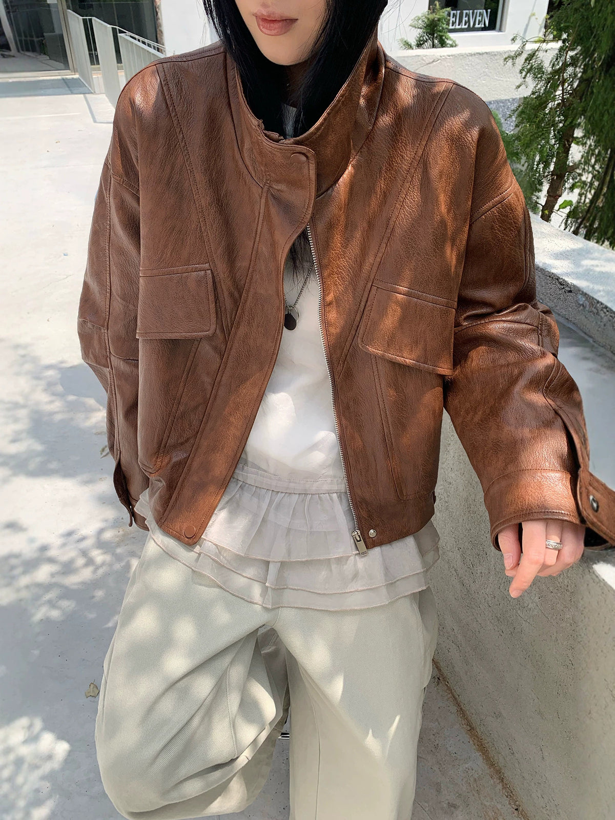 Brown PU leather biker jacket with stand collar, zip front, chest and side pockets