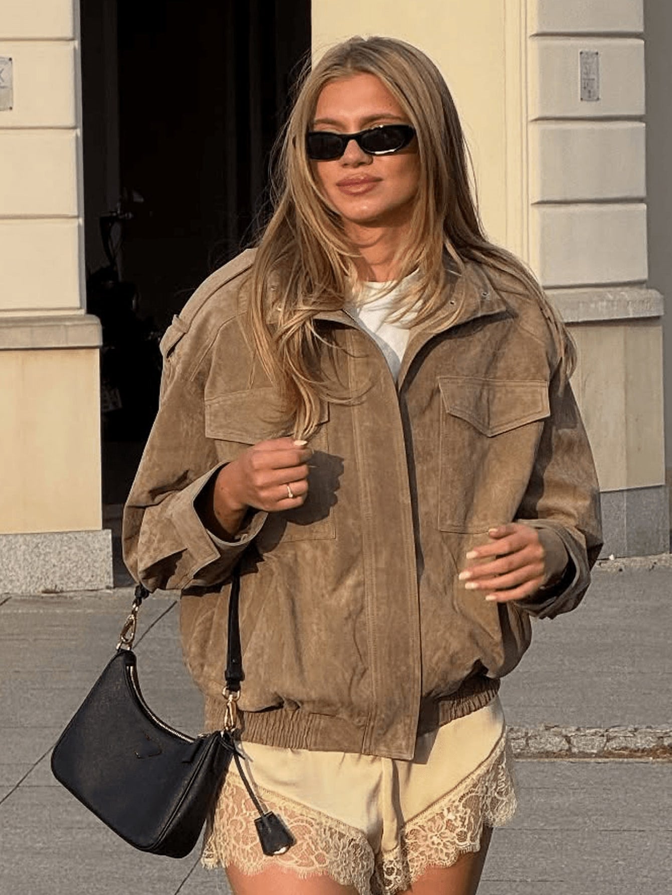 Women’s casual jacket coat in tan with zip front, flap chest pockets, and elastic hem