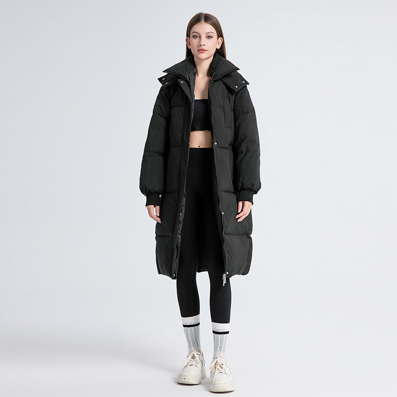 Women’s long hooded puffer cotton coat in black, full length, quilted with zip front.