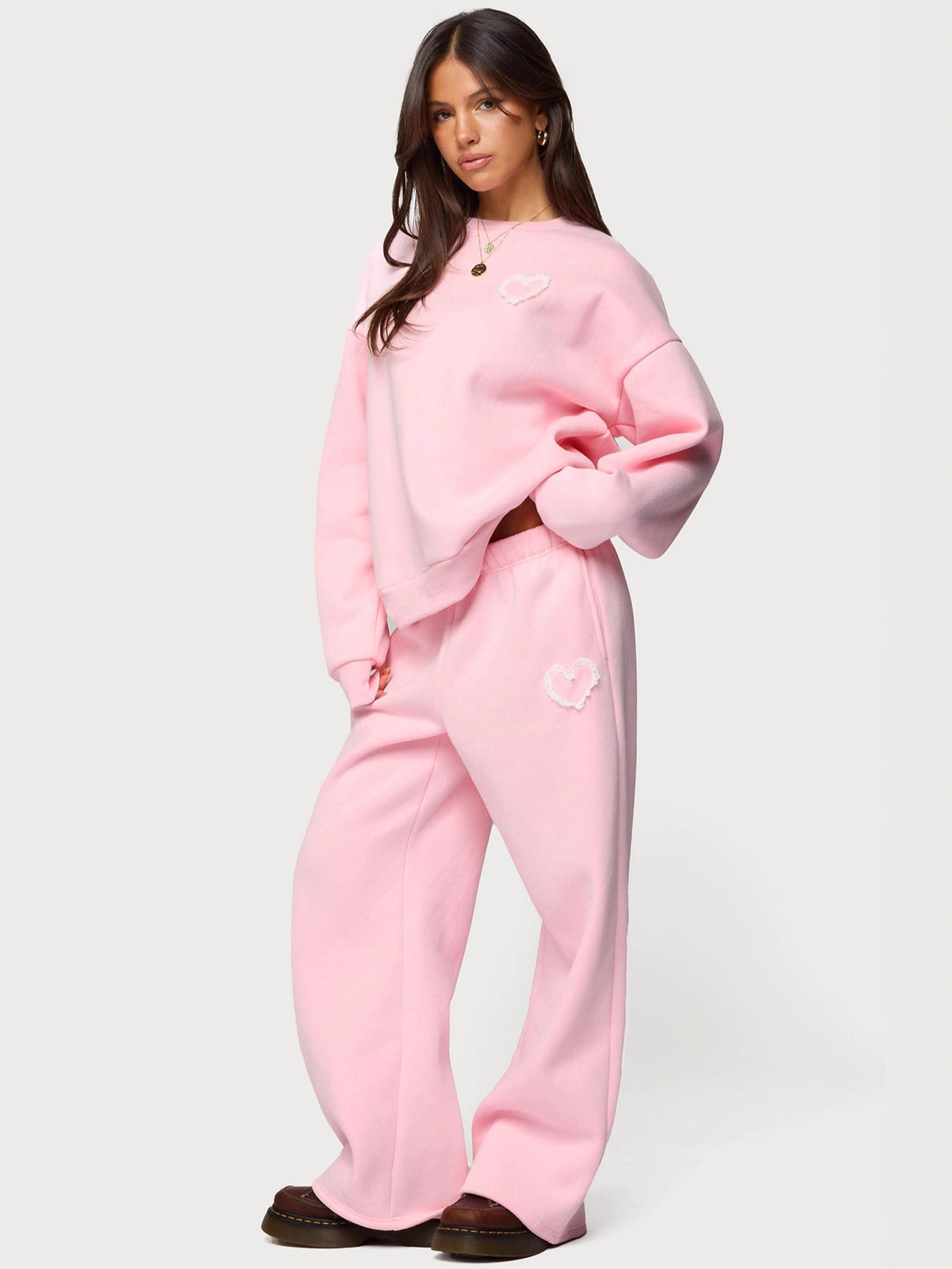 Pink heart-detail hoodie with matching wide-leg sweatpants, relaxed fit