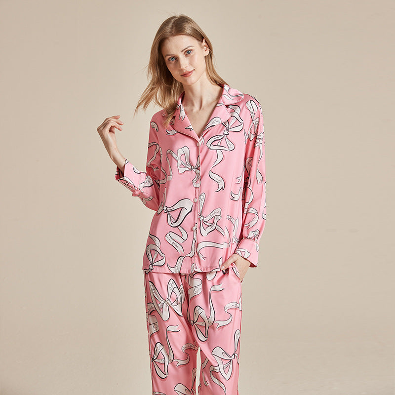 Women’s long-sleeve printed pajama set in pink with whimsical animal motifs