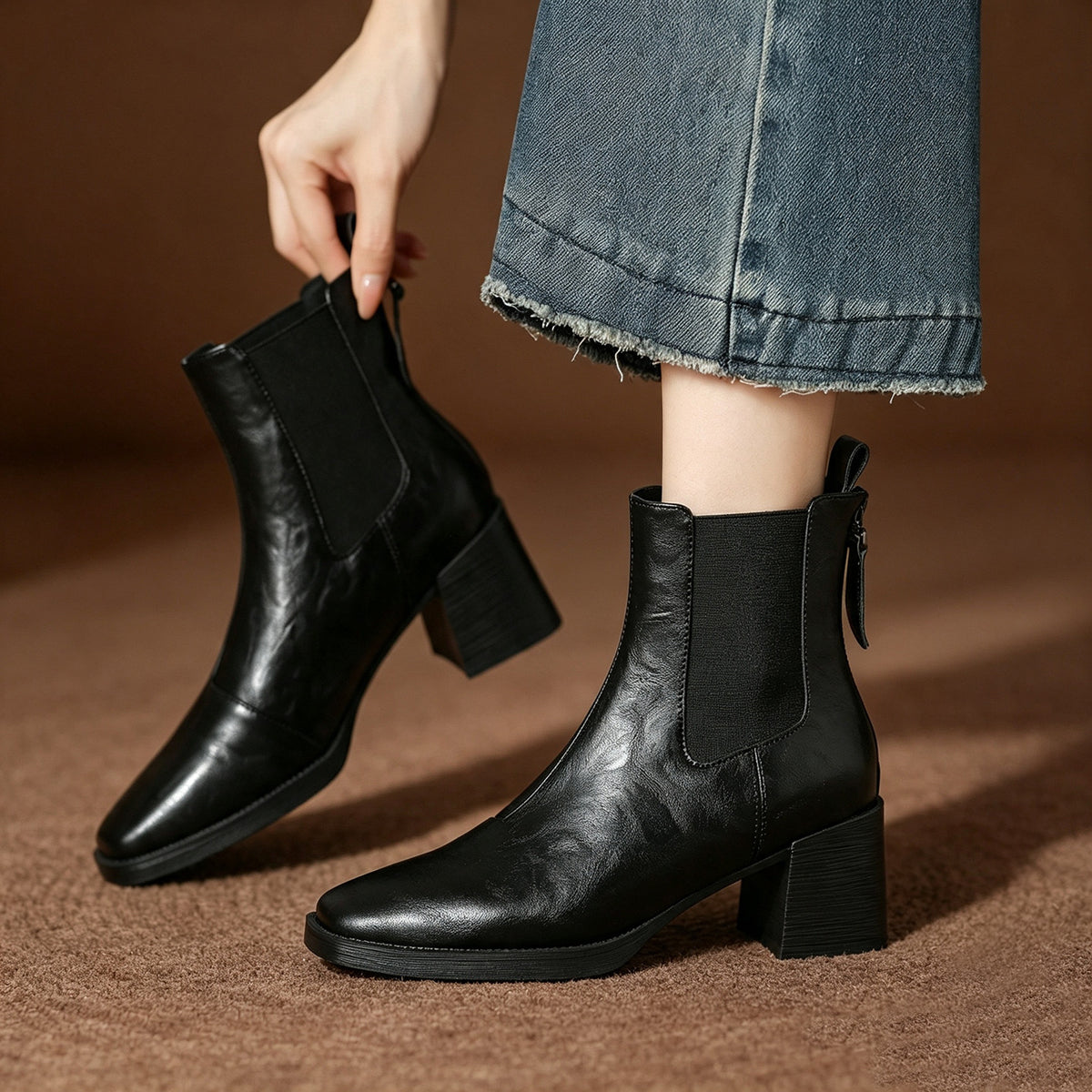 Black Chelsea short boots, square toe and chunky heel, elastic side panels with pull tab.