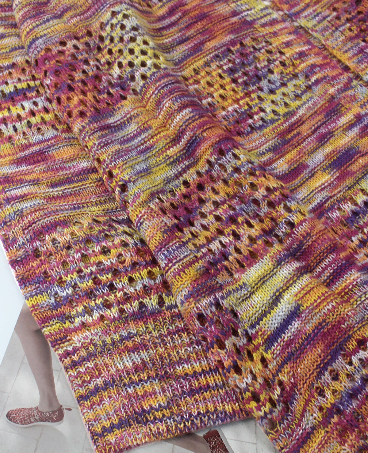Women’s multicolor knit cardigan sweater sleeve and hem texture close-up