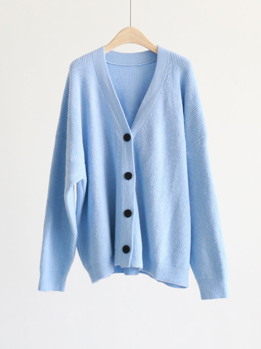 Light blue V-neck mohair cardigan on hanger, button front and long sleeves