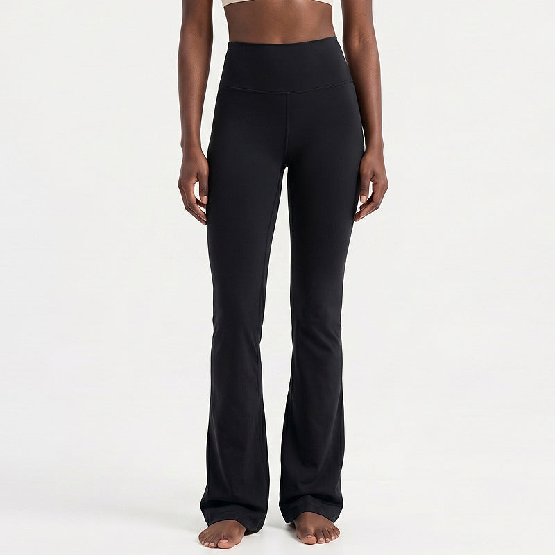 High-waisted flare yoga pants in black, clean lines and wide bell-bottom legs
