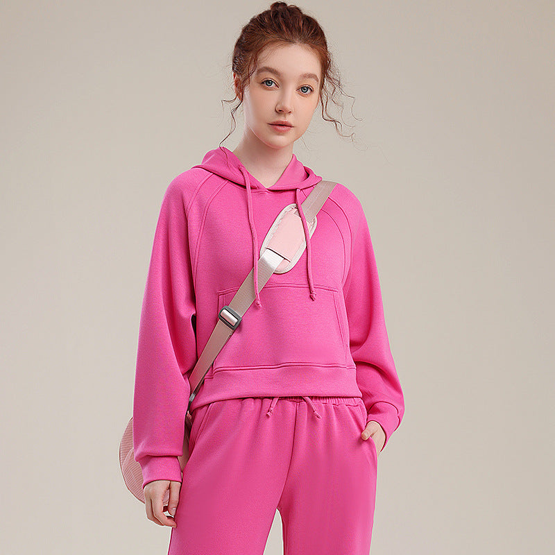 Pink hooded sweatshirt and matching sweatpants set, loose fit with drawstring hood