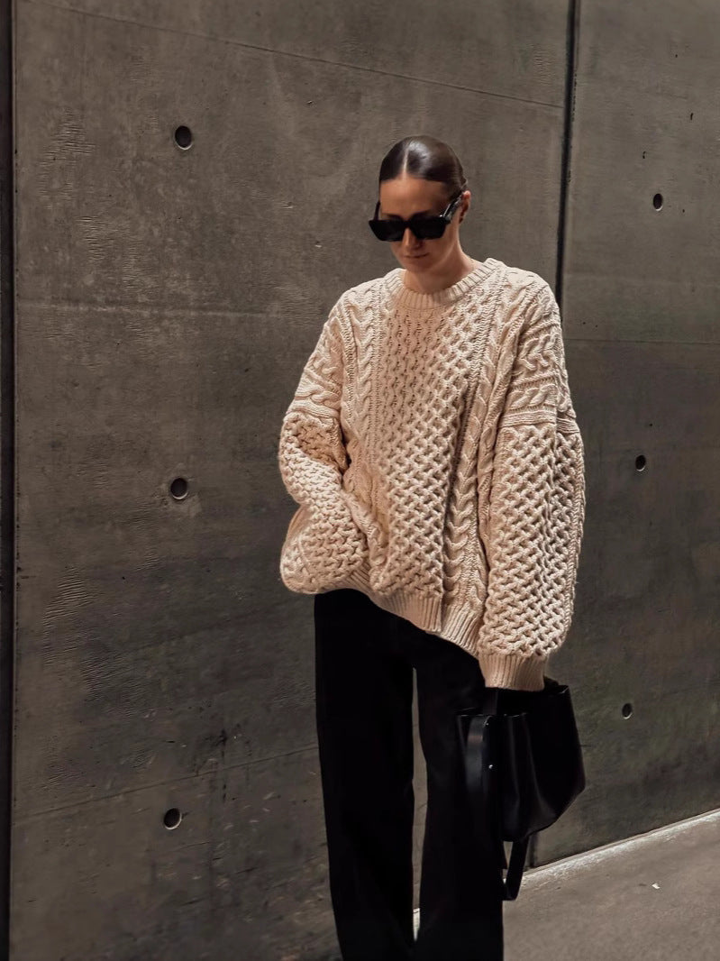 Beige cable-knit turtleneck sweater with long sleeves, textured cable pattern