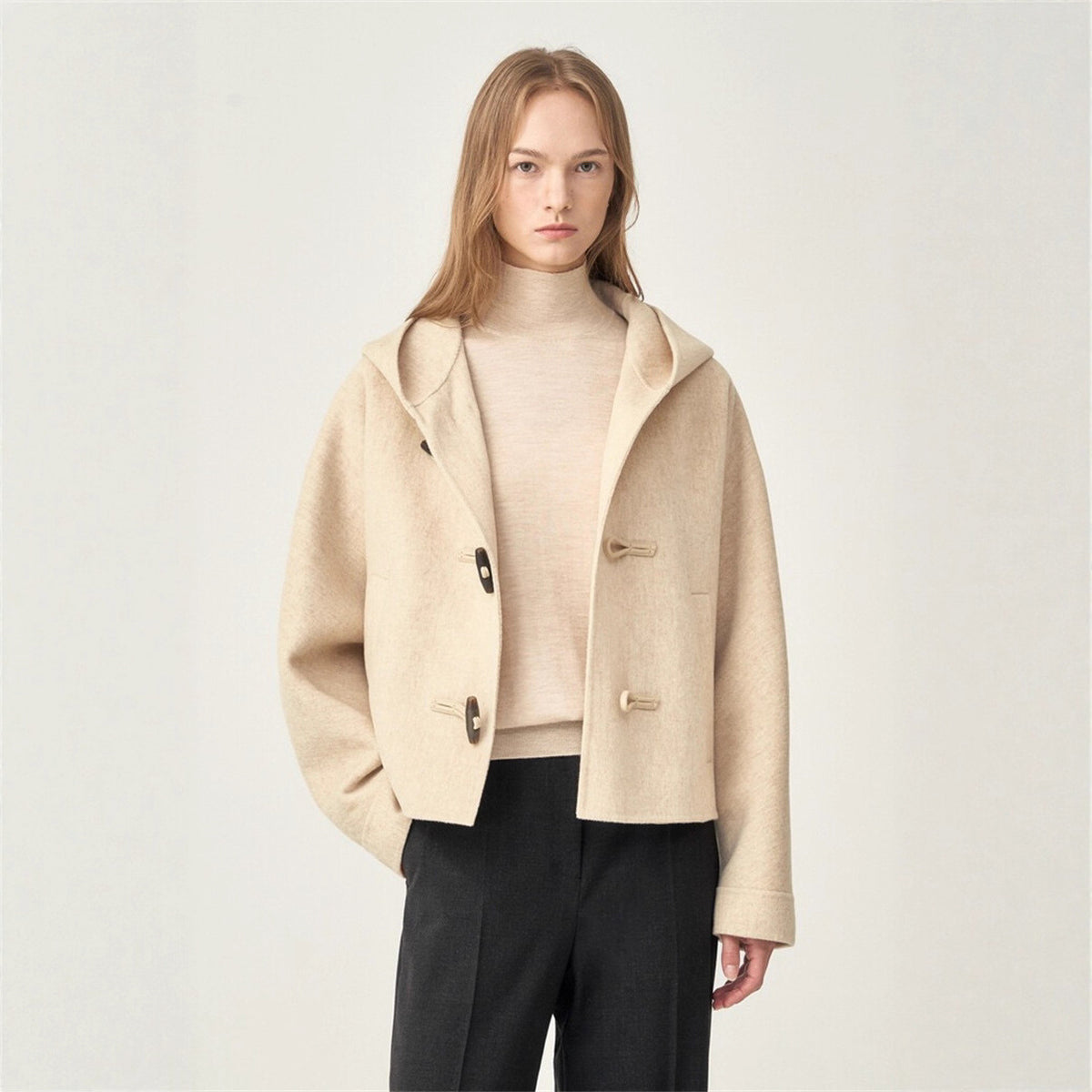 Oat short hooded wool coat with buttoned front, flap pockets, and relaxed fit
