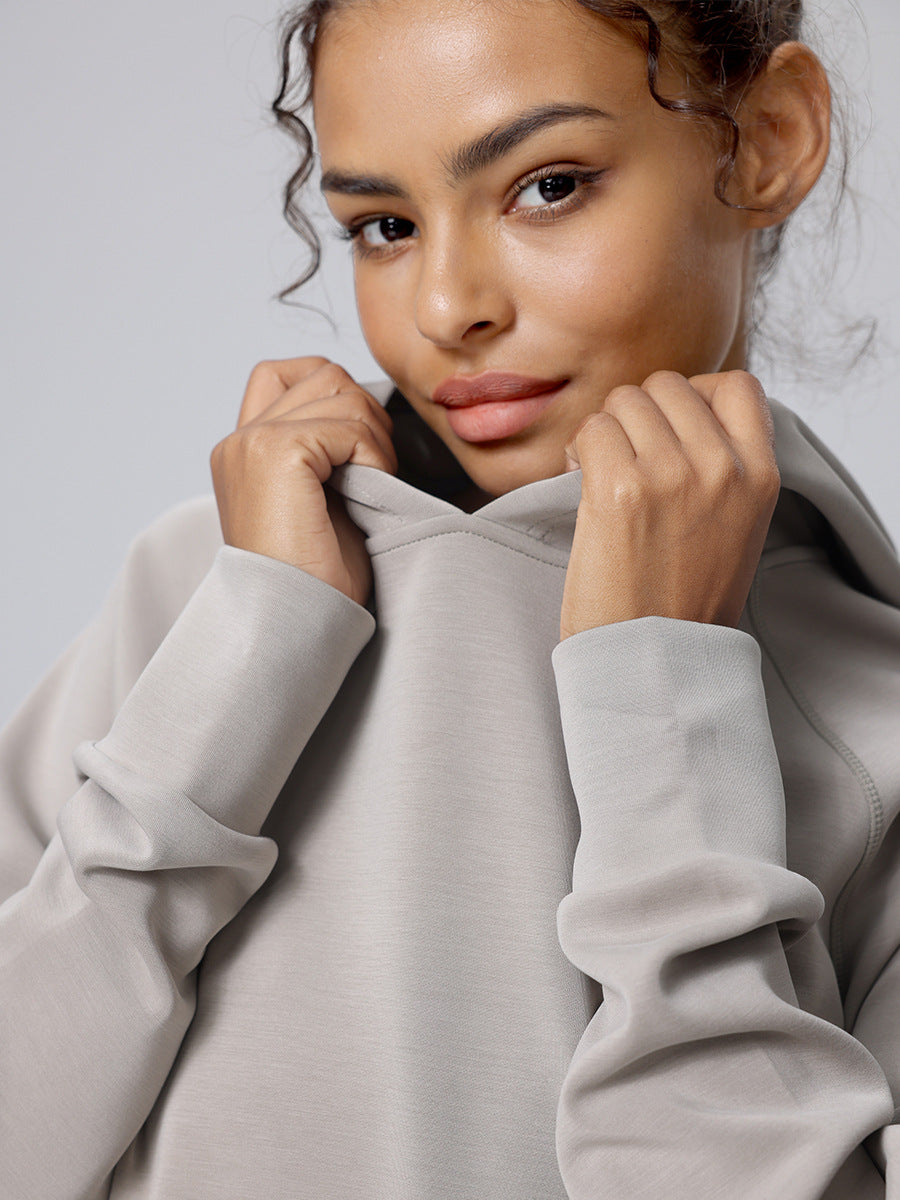 Light gray hooded pullover sweatshirt with kangaroo pocket and long sleeves