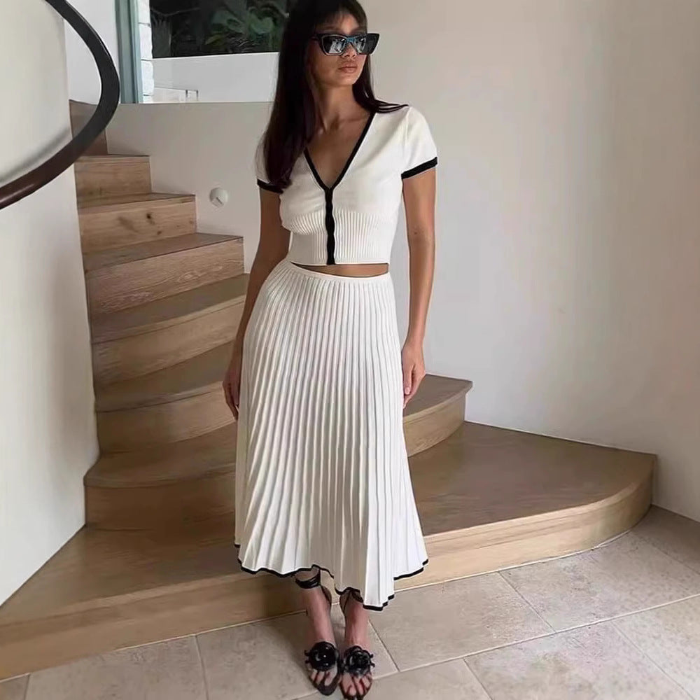 White knit two-piece set: cropped V-neck top and pleated midi skirt