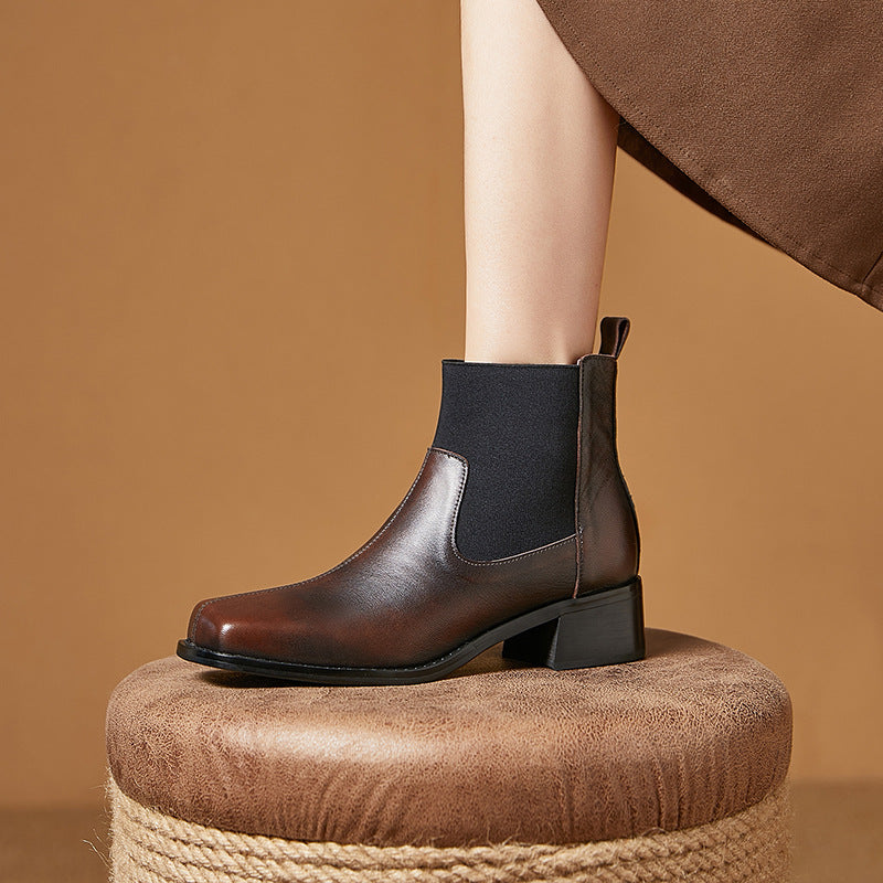 Women’s brown leather Chelsea ankle boots with dark elastic side panels and block heel