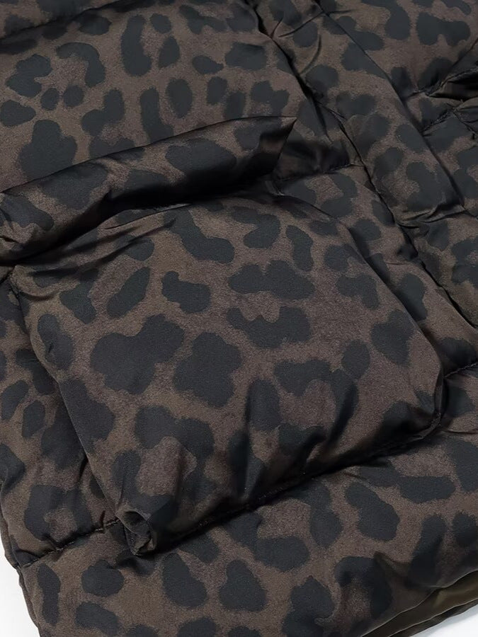 Leopard print puffer jacket fabric close-up with quilted stitching