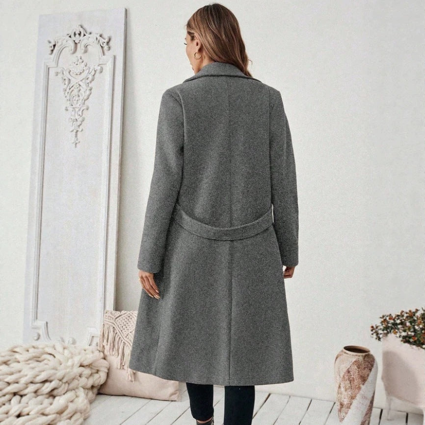 Gray long wool double-breasted coat, back view with notched lapels and centered seam.