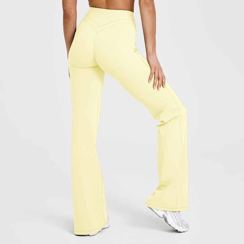 Women’s flared yoga pants in pale yellow with sculpted seams and wide bell hems