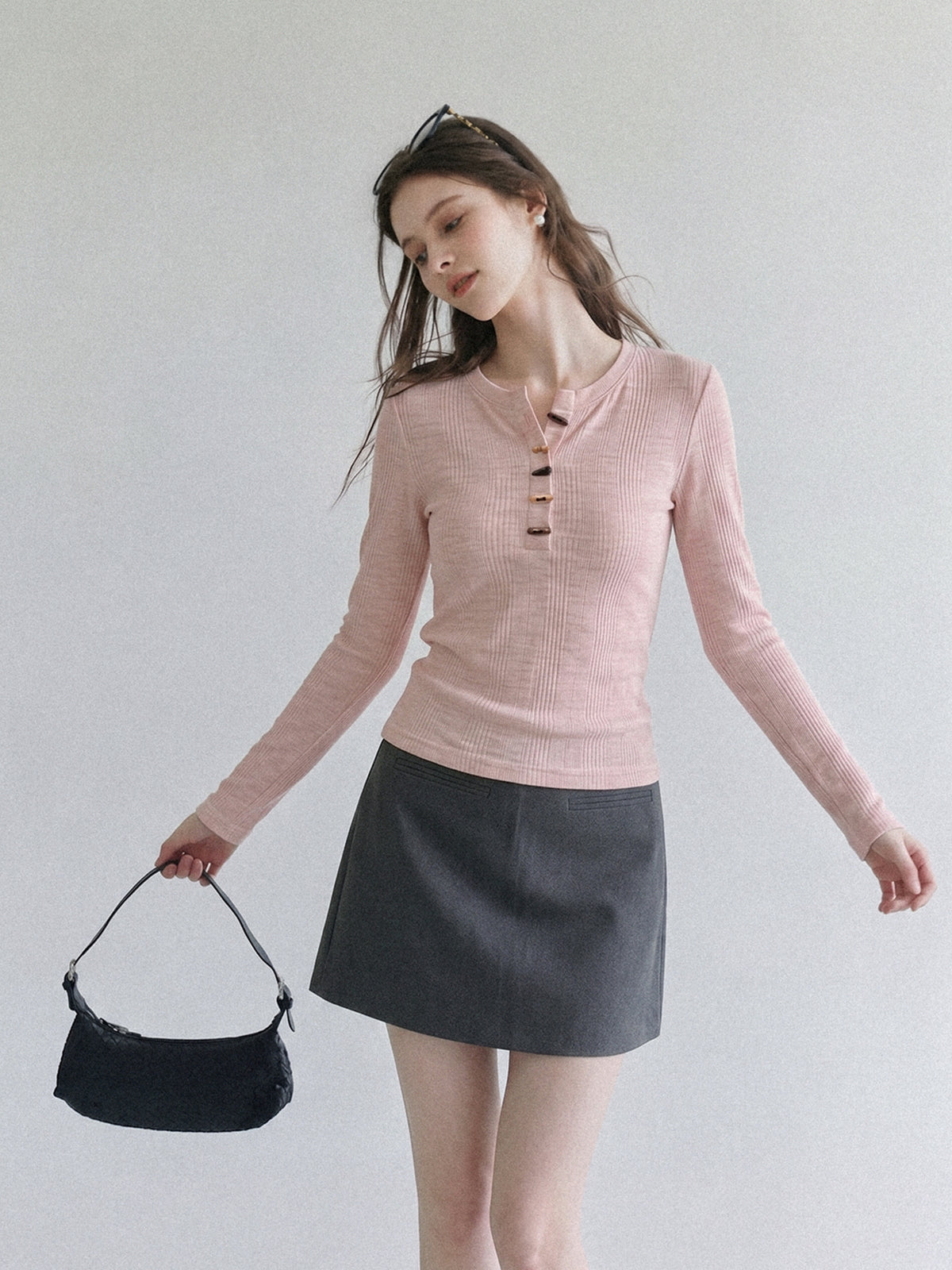 Women's pink long-sleeve henley T-shirt with half-open collar and horn-button placket