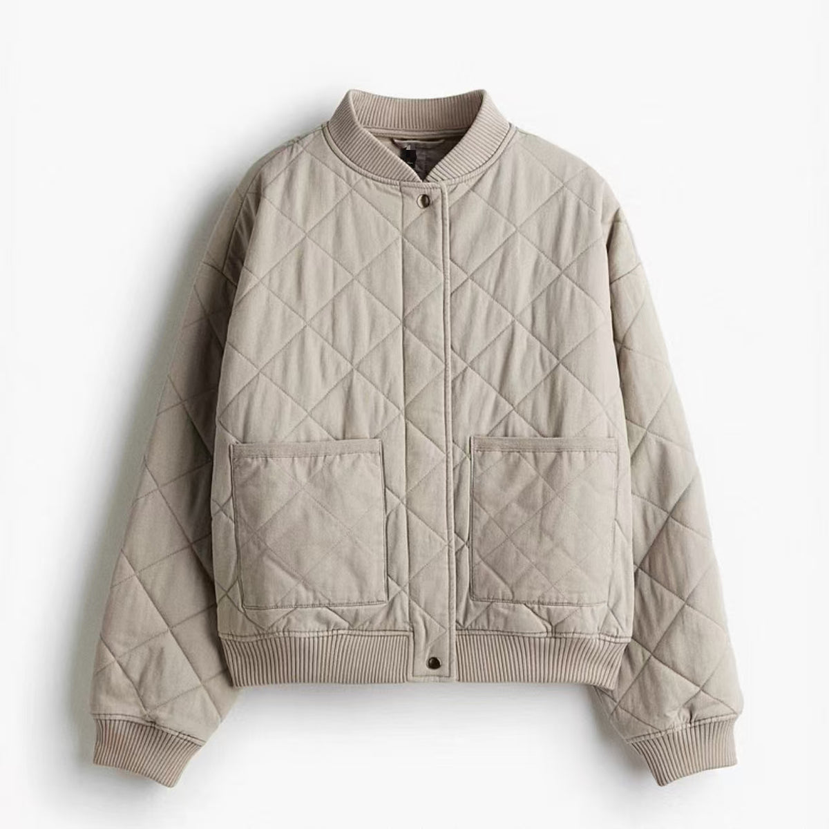 Light beige quilted cotton bomber jacket with stand collar and front patch pockets