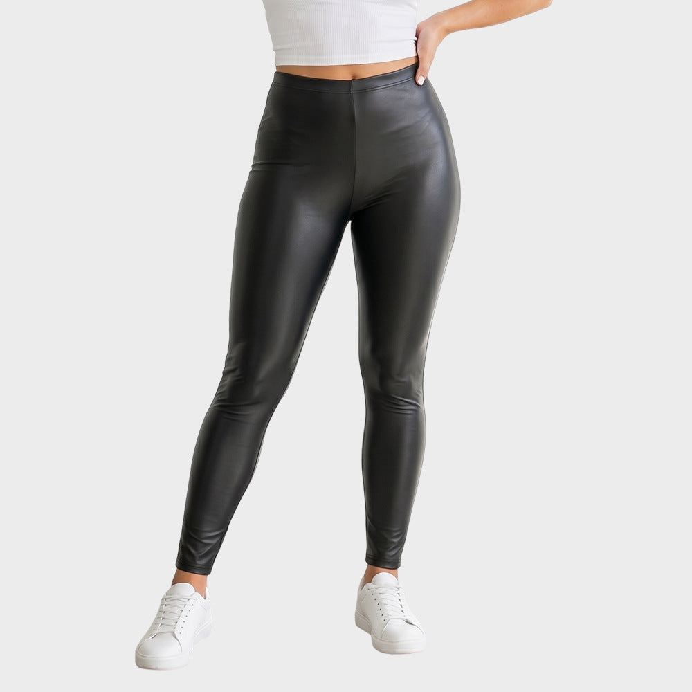 Black high-waisted faux leather leggings, straight slim legs, full length view