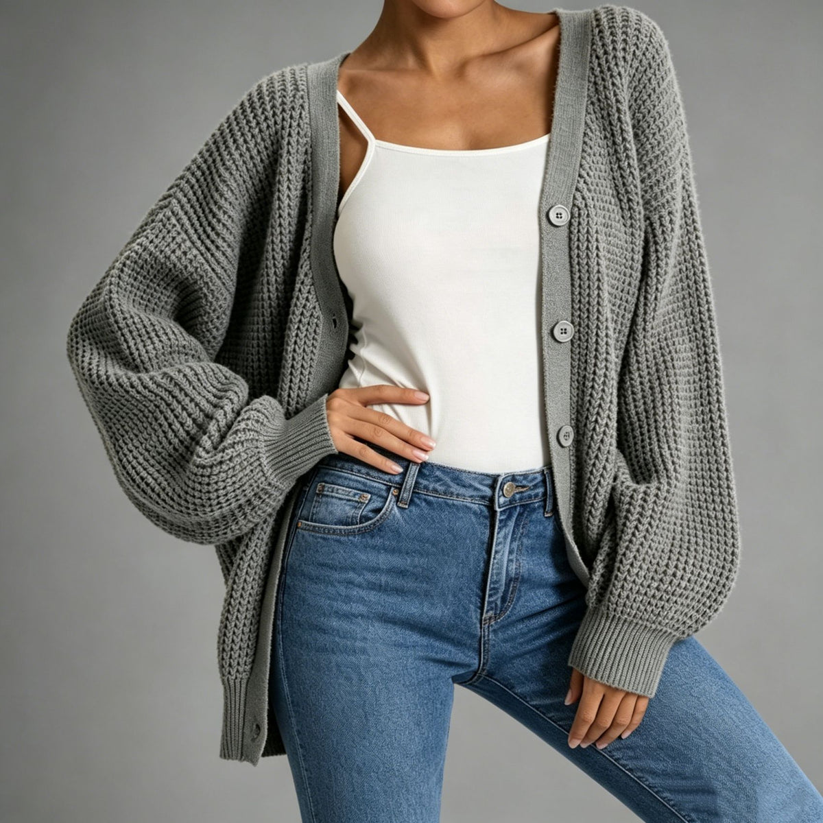 Dark gray chunky knit cardigan with button front, shawl collar, ribbed cuffs