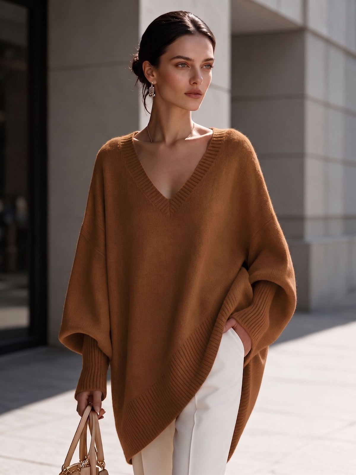 Women's camel V-neck knit pullover with batwing sleeves and asymmetric hem