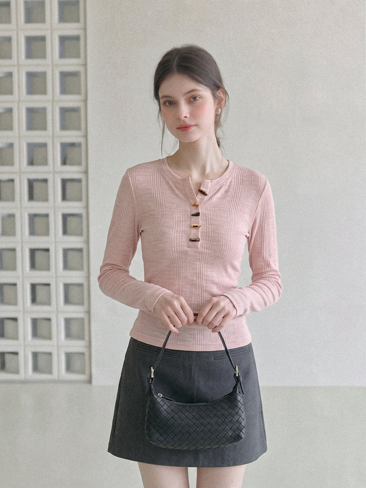 Women's pink long-sleeve henley T-shirt with 3-button half placket, fitted neckline