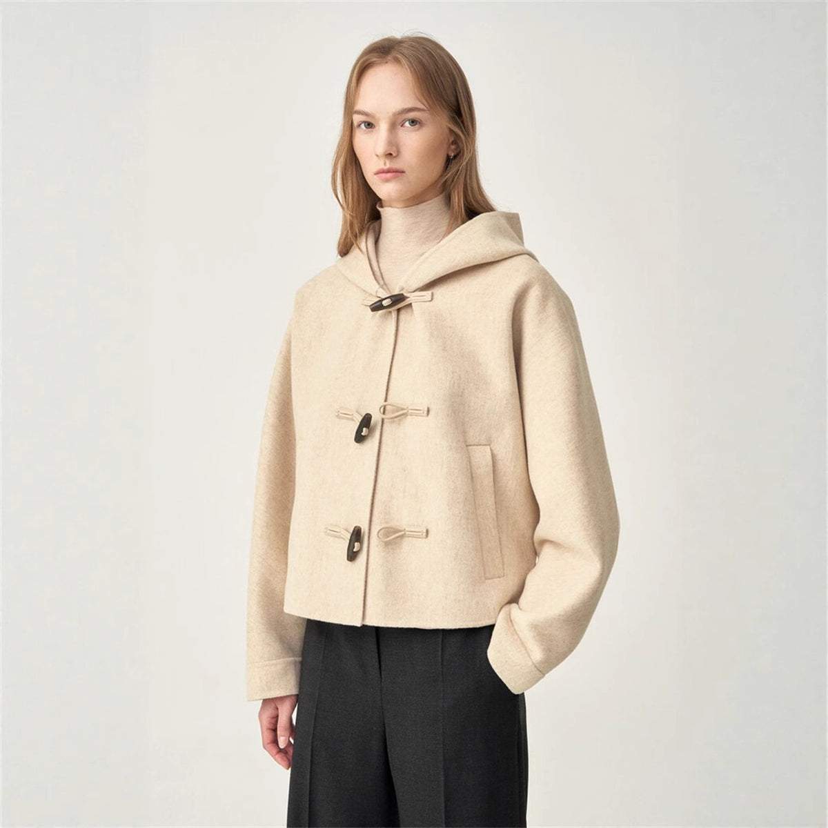 Oat short hooded wool coat with toggle buttons, flap pockets, and stand collar