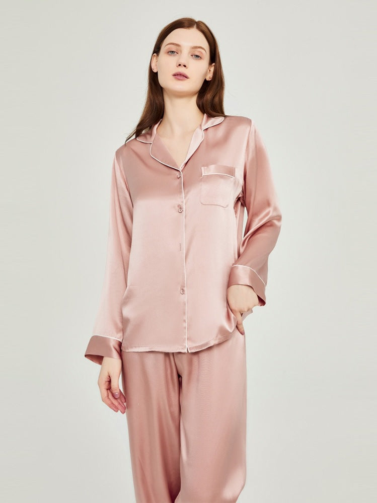 Blush pink silk pajama set with pocketed button-up shirt and matching pants