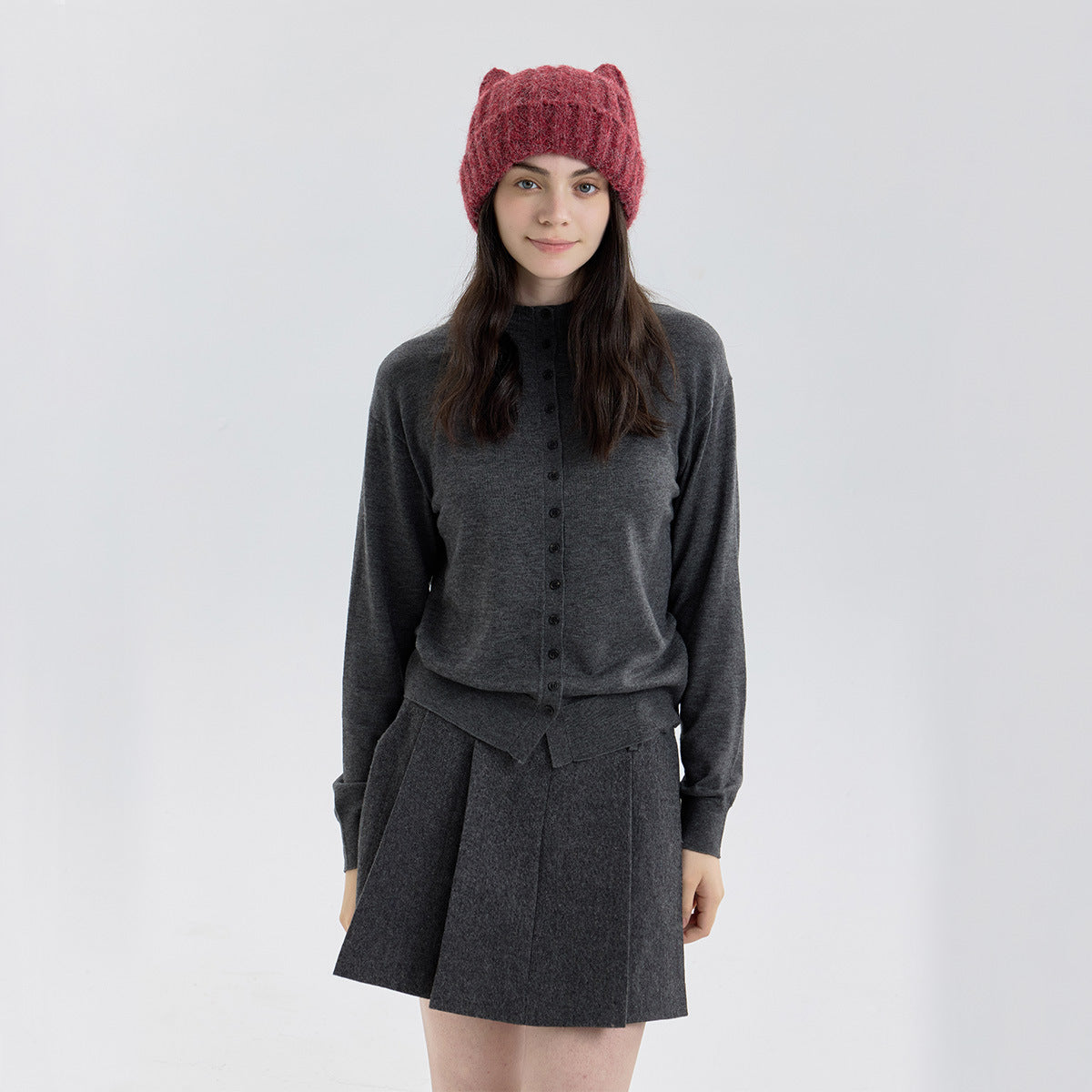 Burgundy cat-ear knit beanie with thick wool-like texture and ribbed cuff