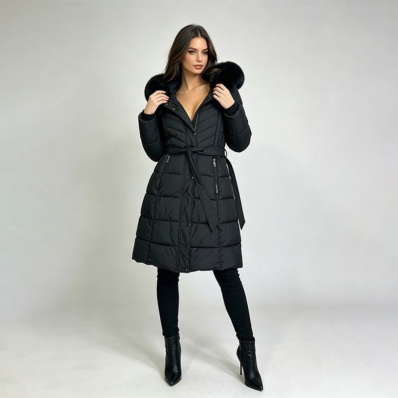 Women's long belted puffer coat with fur-trimmed hood and pockets, black