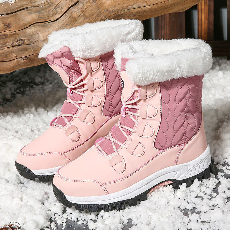 Pink high-top winter snow boots with plush cuff, lace-up straps, and grippy sole