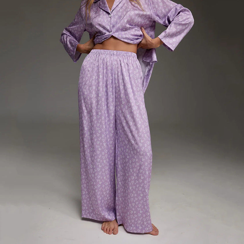 Women's lavender printed pajama set, ruched waistband wide-leg trousers and button shirt.