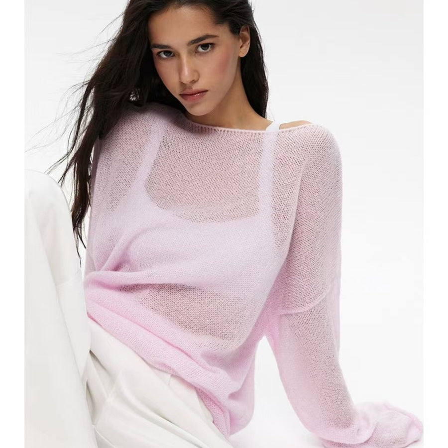 Pink women’s loose knit sweater top with round neck, long sleeves, and sheer hollow texture