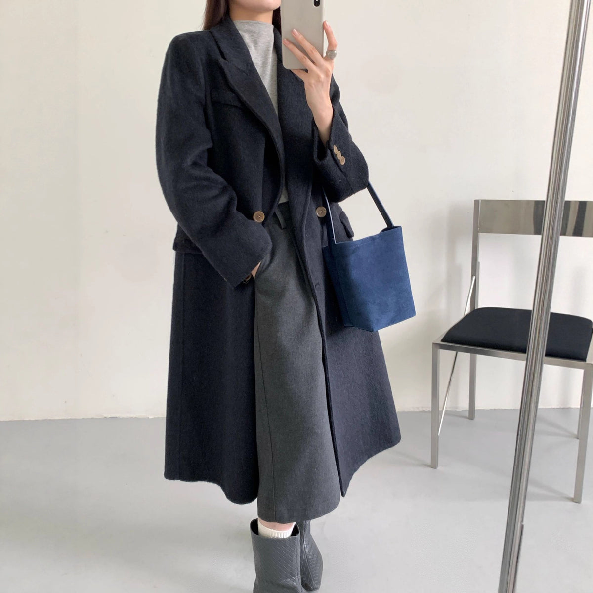 Dark navy long double-breasted cashmere coat with high collar and buttoned cuffs