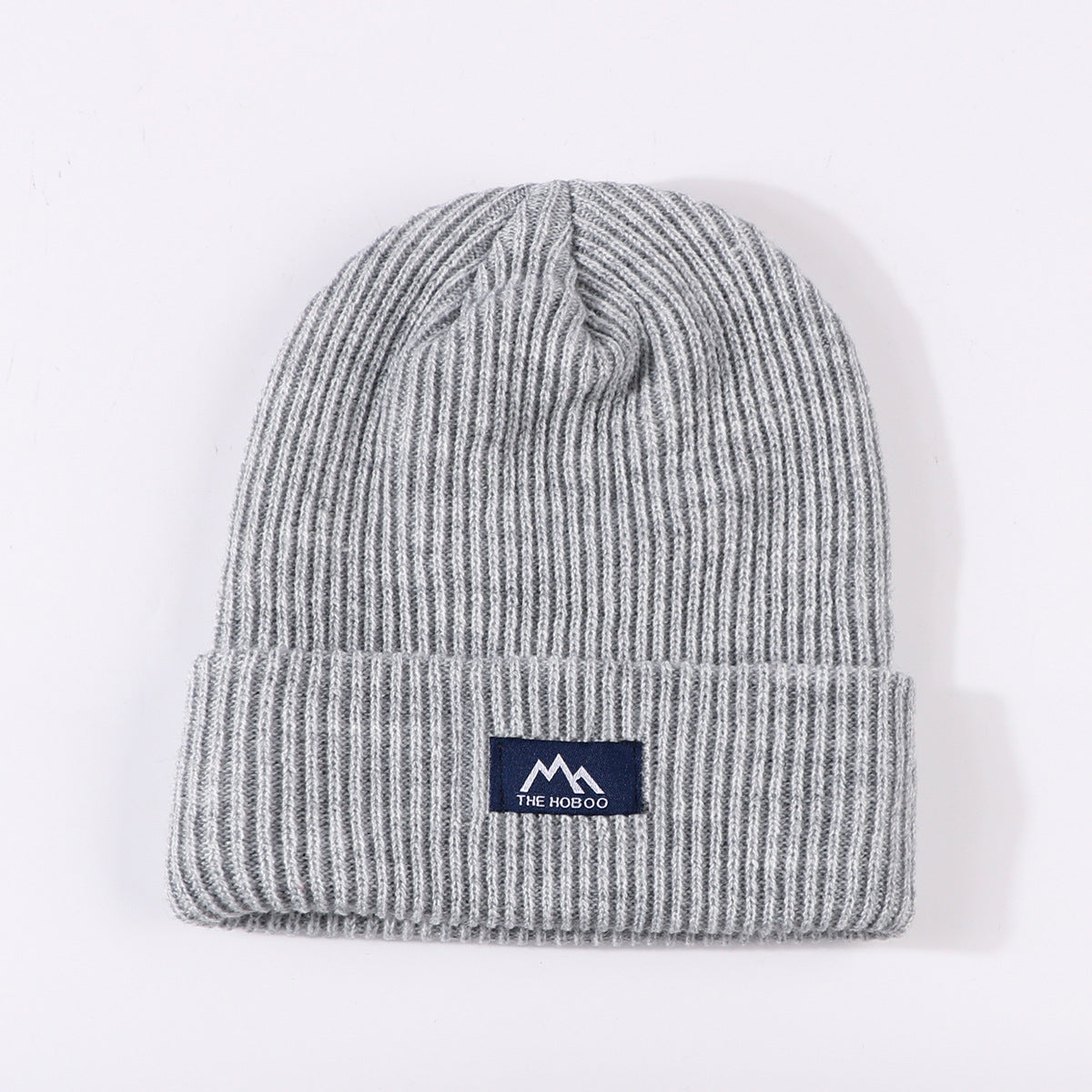 Light gray ribbed knit beanie with fold-up cuff and THE HOBOO logo patch
