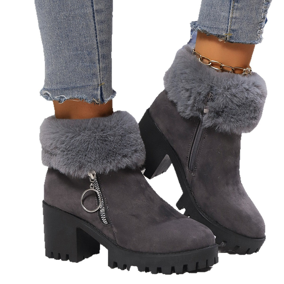 Pair of dark gray suede snow boots with faux fur cuffs, side zipper and chunky heel.