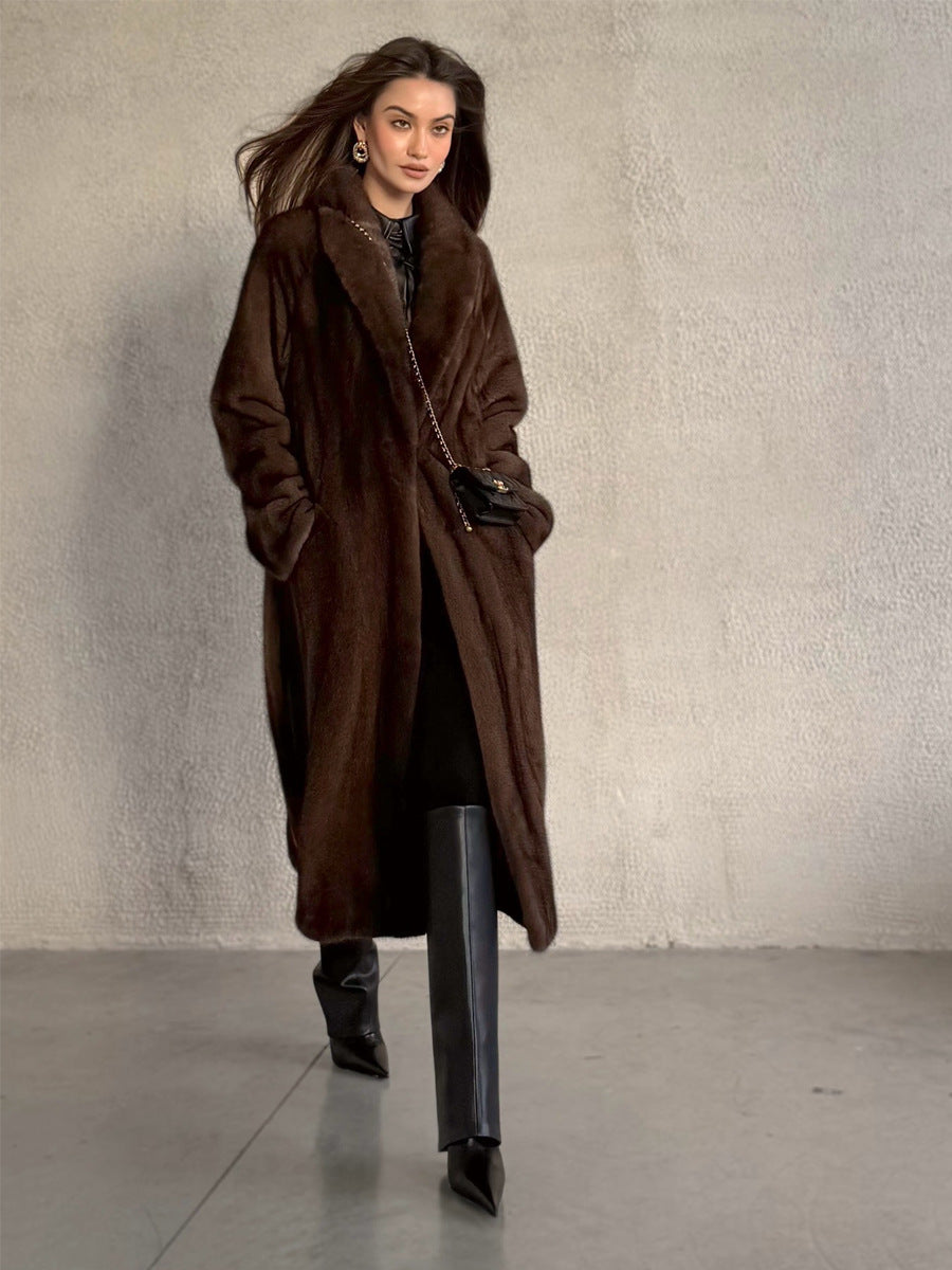 Dark brown long faux fur coat on model, front view with open plush collar