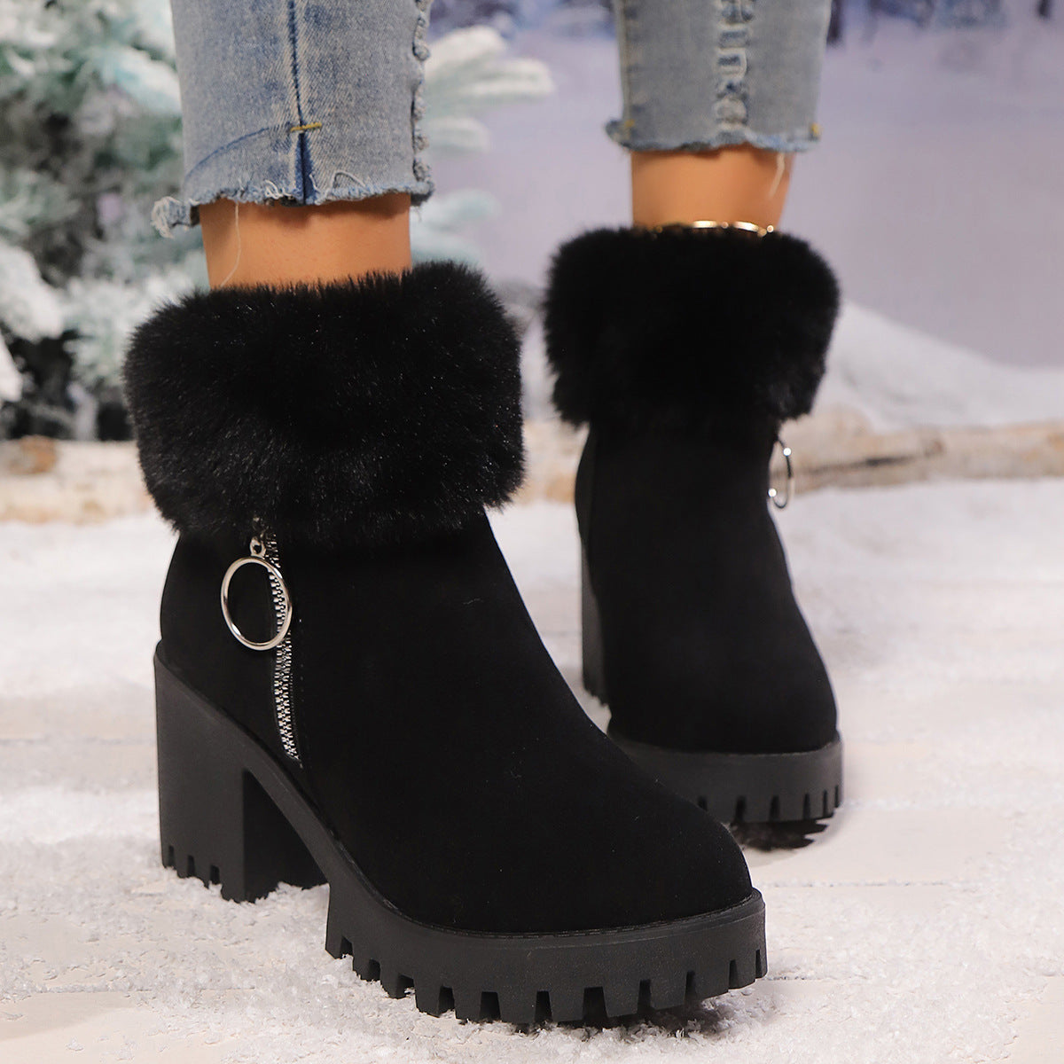 Black suede snow boots with faux fur cuffs, chunky block heel and side zipper detail.