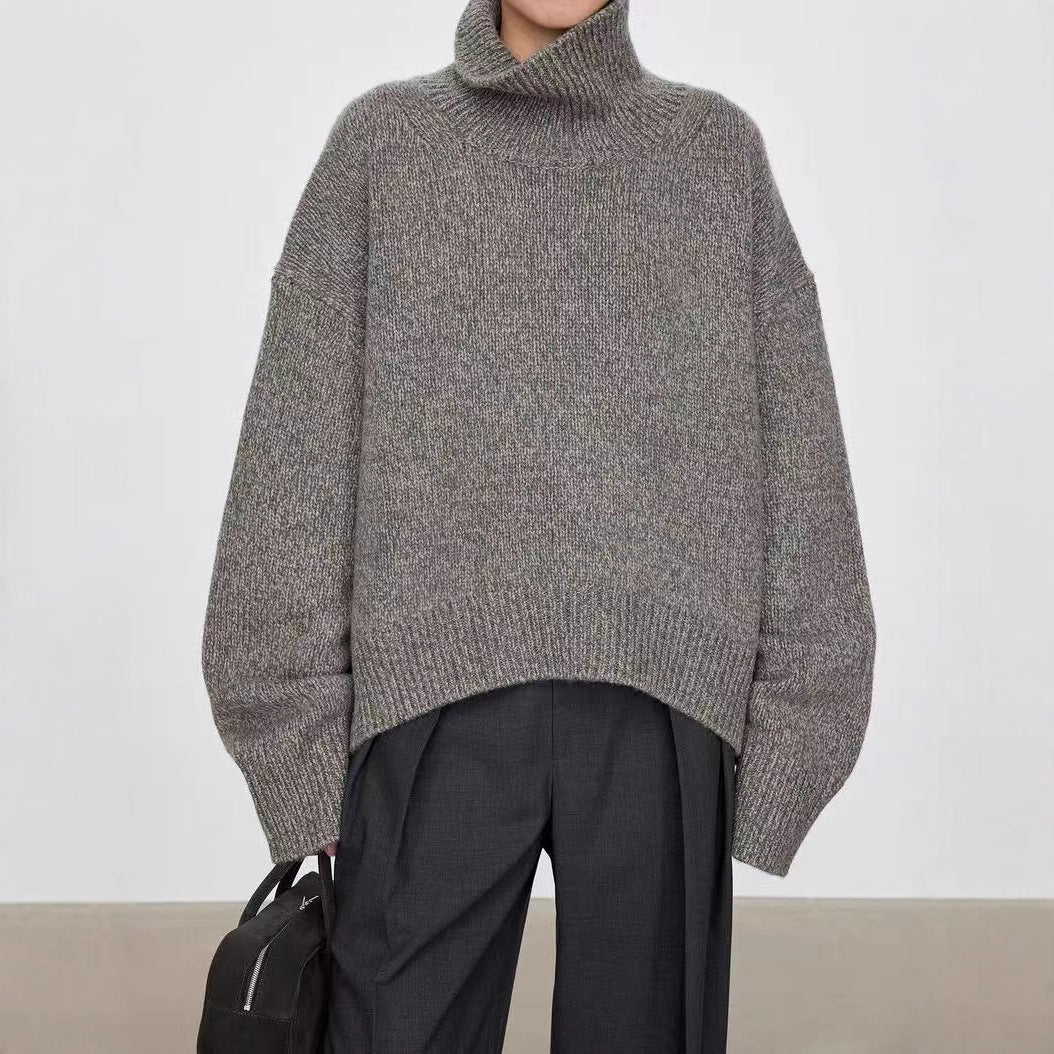 Dark gray knitted turtleneck sweater with oversized sleeves and ribbed hem