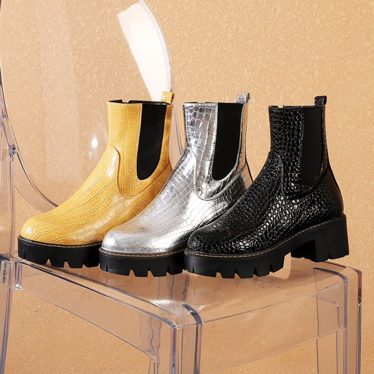 Crocodile-pattern Chelsea boots in yellow, silver, and black with chunky lug soles