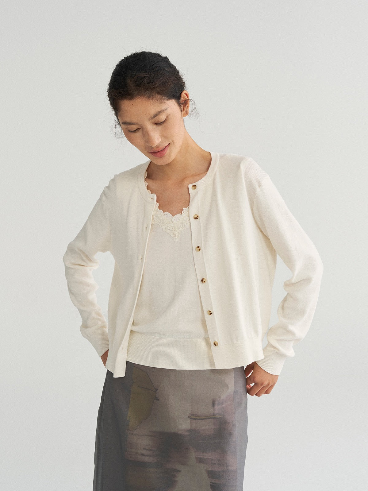 Women’s cream knit vest-coat set with button front and lace-trim camisole