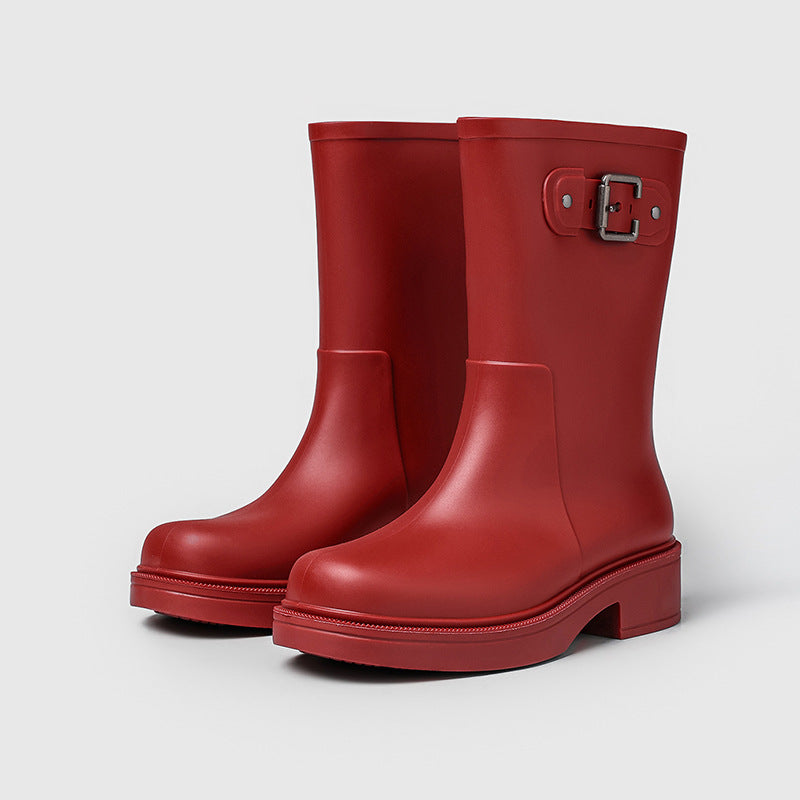 Women's red mid-calf rain boots with side buckle and flat sole