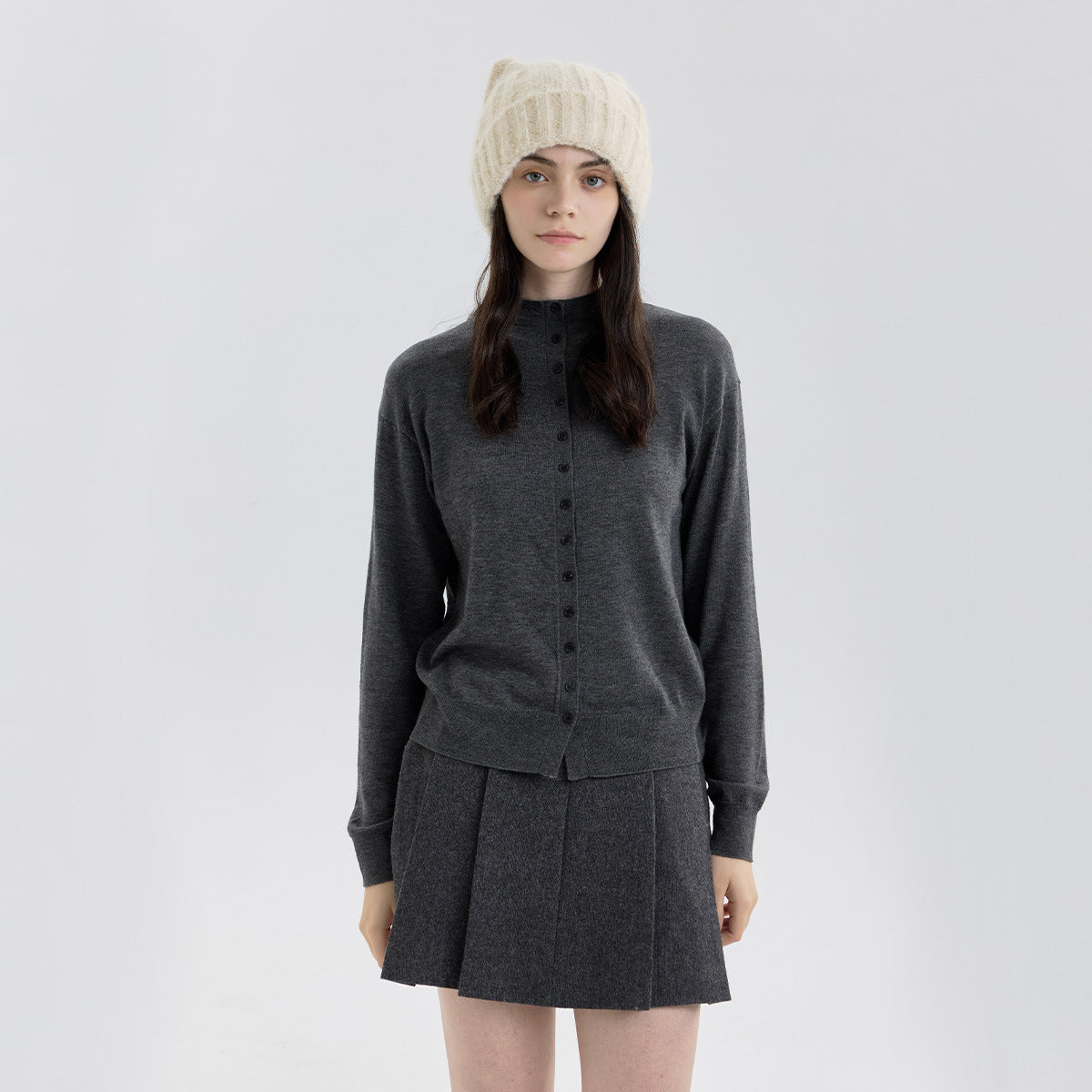 Cream/beige cat-ear knit beanie with thick wool-like texture and ribbed cuff