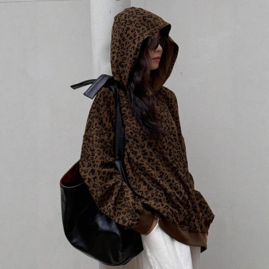 Leopard print pullover hoodie with hood up and long sleeves, cropped hem