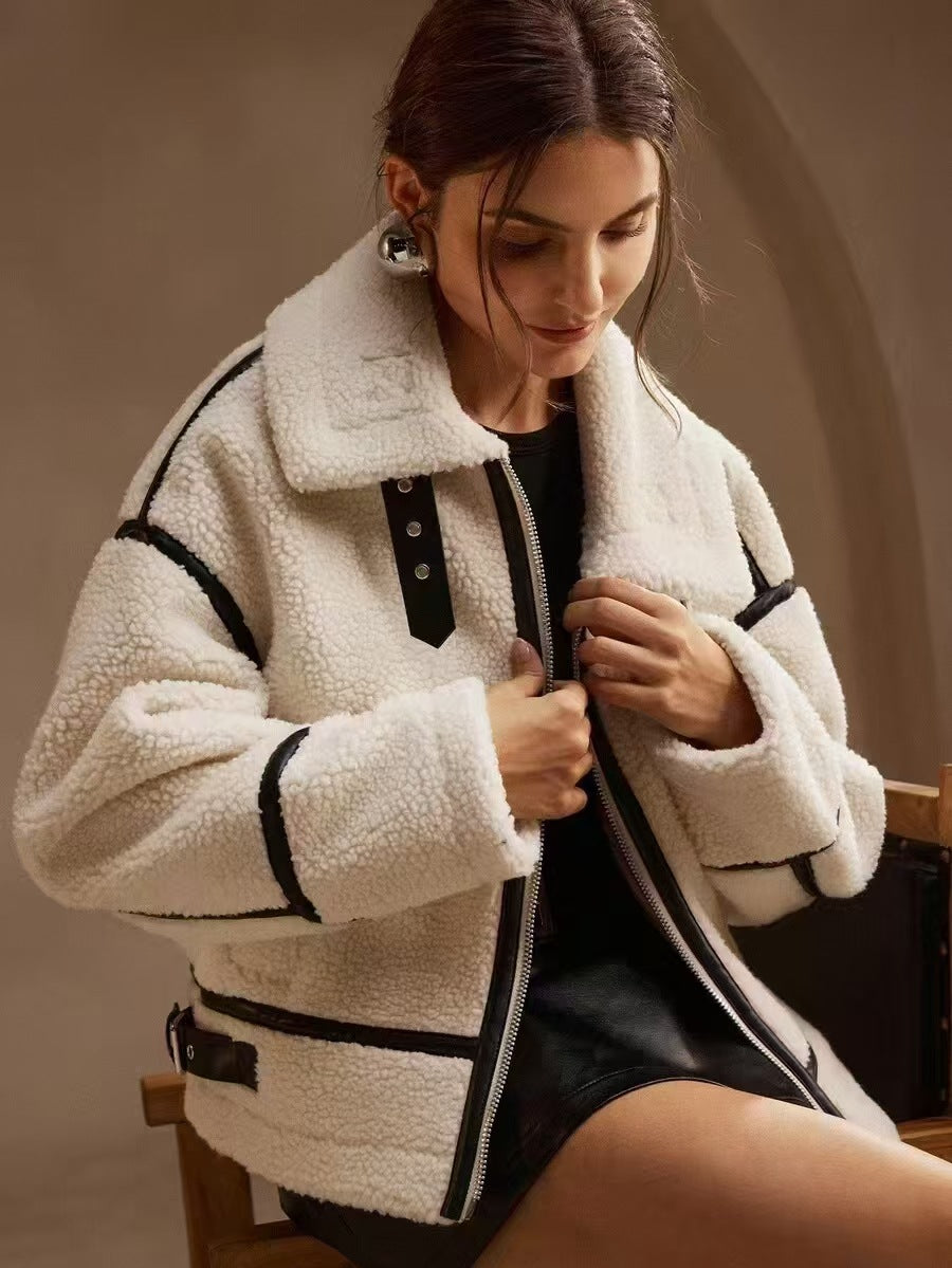 Cream sherpa jacket detail: zip front, snap placket, side pockets, black trim