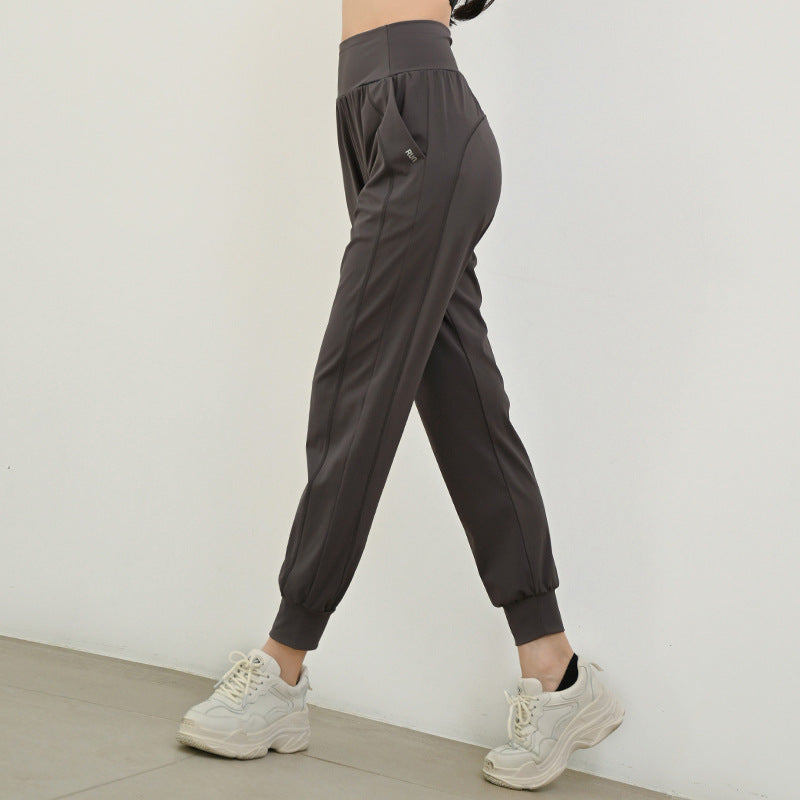Women's charcoal athletic jogger pants with elastic waistband and tapered ankle cuffs