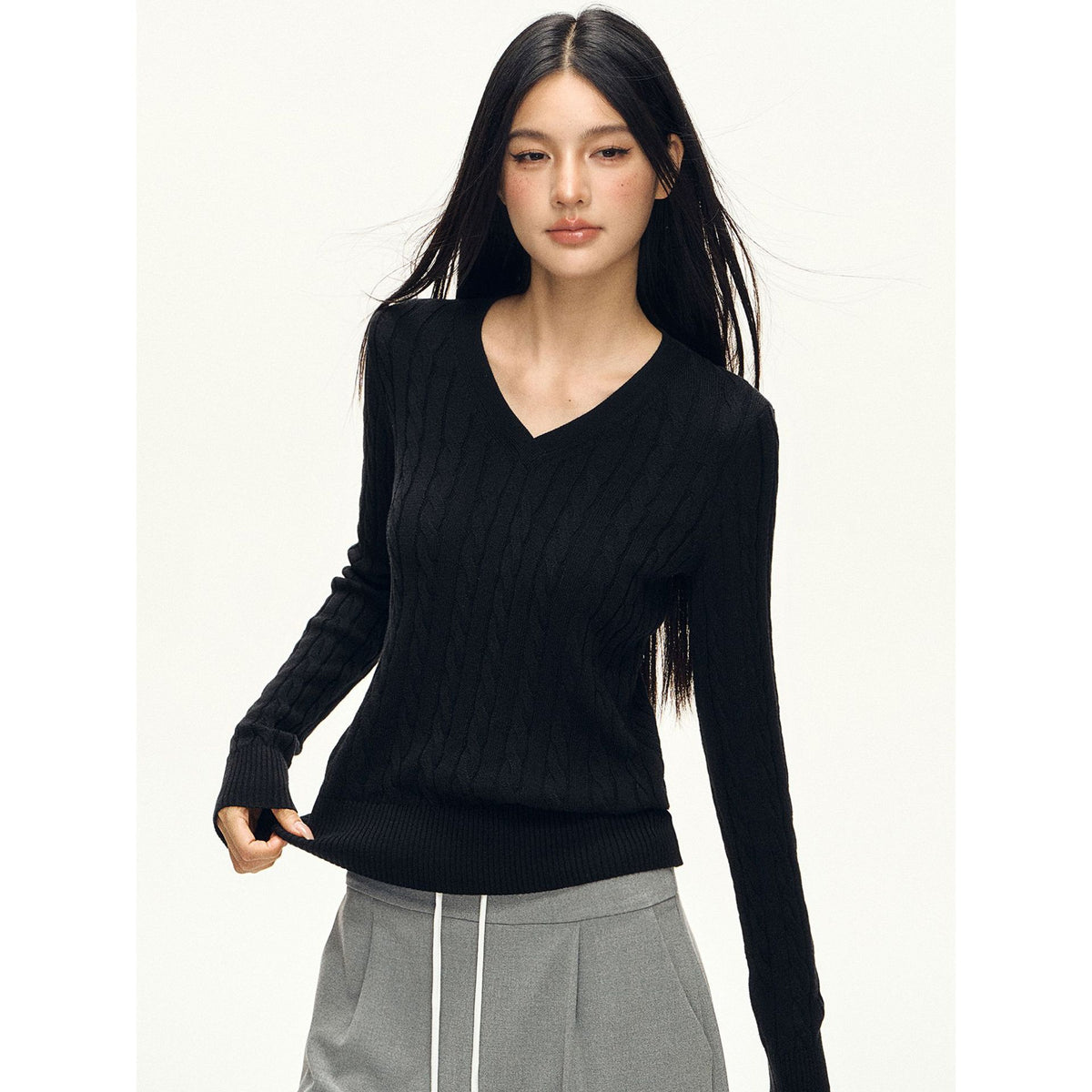 Women’s black V-neck twist knit sweater with long sleeves, slim fitted knit