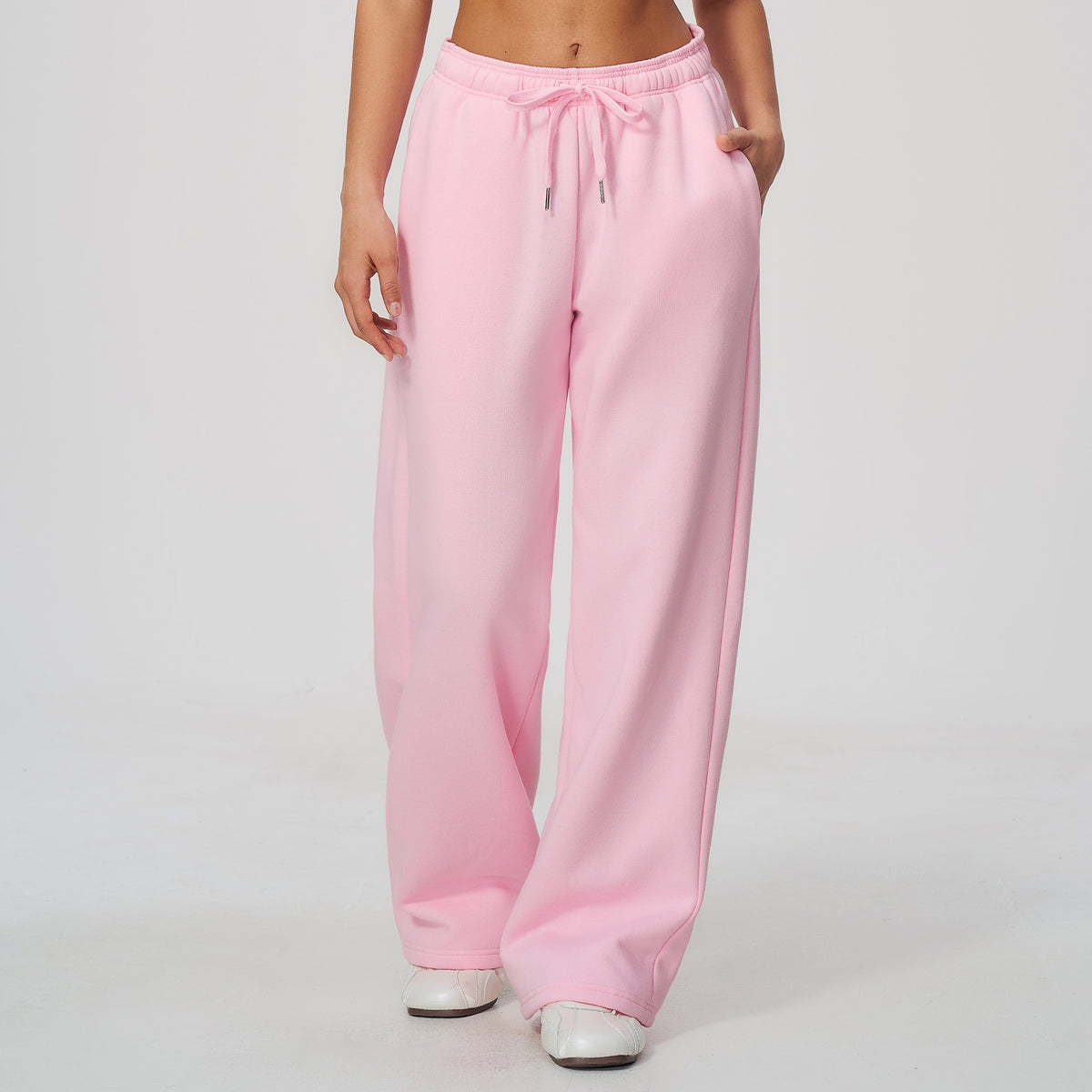 Pink high-waisted sweatpants with elastic waistband and drawstring, relaxed wide-leg